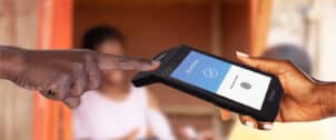 FP200 scanning a finger for biometric identification (KYC) while buying or reloading SIM cards